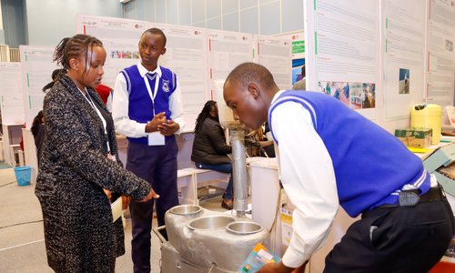 Students showing their project at a fair
