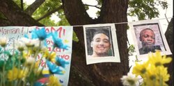 still from video with memorial pictures on a line