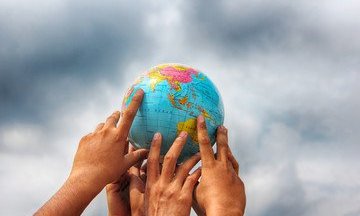 Hands on a globe