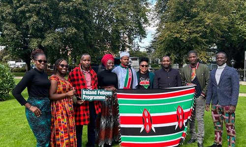 Ireland Fellows Programme participants gathered with Kenyan flag for group photo
