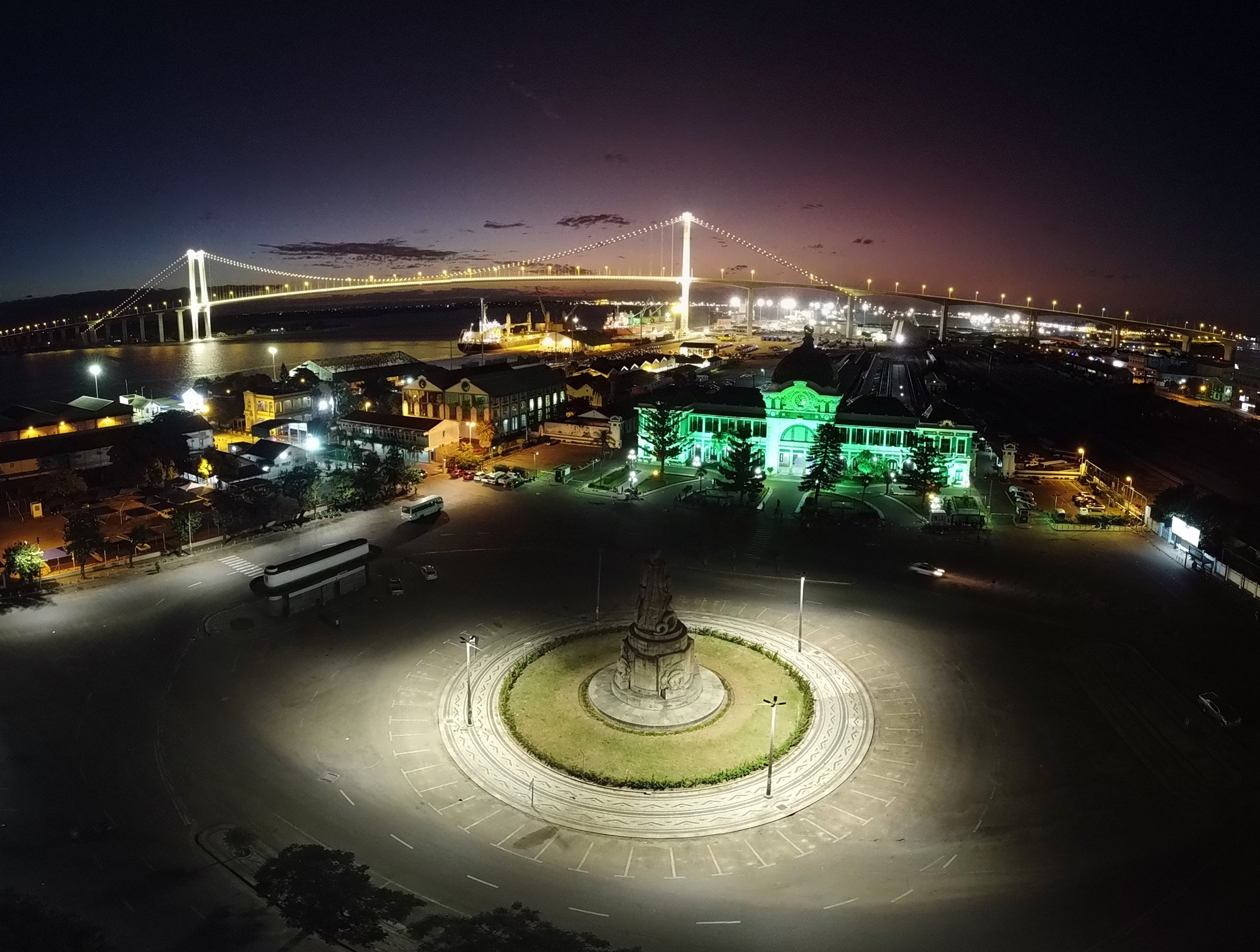 Praça da Independência in Maputo, Mozambique lit up green at night.