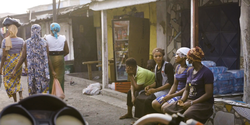 still from video of women chatting in street